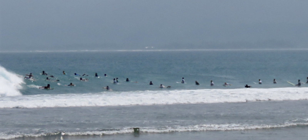Crowded surf break Krui