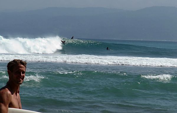 Surfer heading to Krui Left