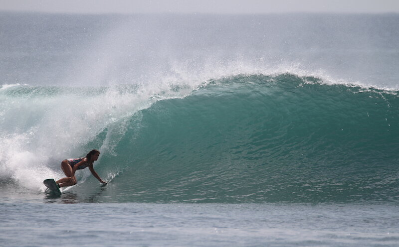 Woman surfing 1.8 meter wave at Krui Left