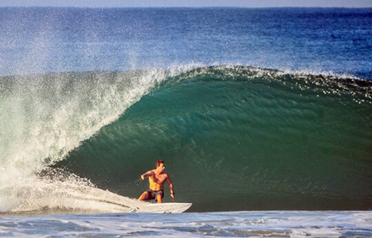 Pulling into a tube at madiri Beach Sumatra