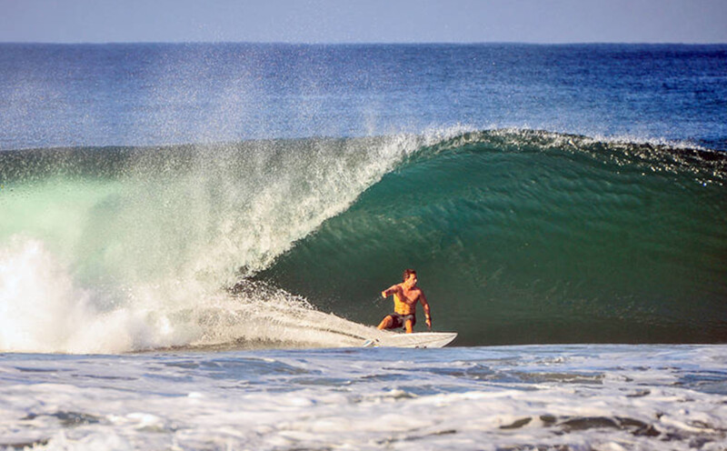 Pulling into a tube at madiri Beach Sumatra