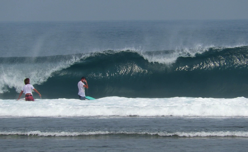 Surfers stuck on the reef at Ujung Bocur